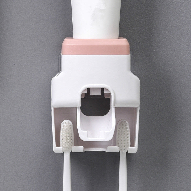 Automatic toothpaste squeezing toothbrush holder